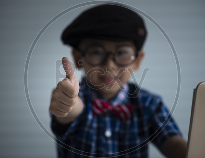 A Young Thai Boy Or Child Student Showing Thumps Up Gesture