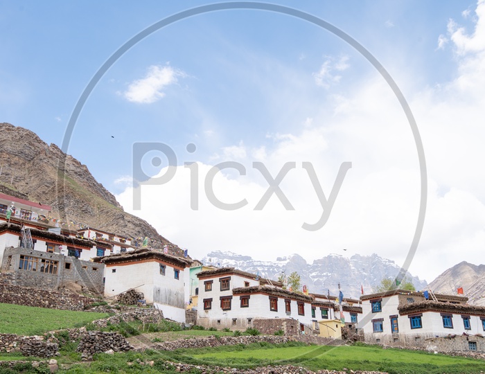 Houses in Spiti Valley with snow clad mountains in the background