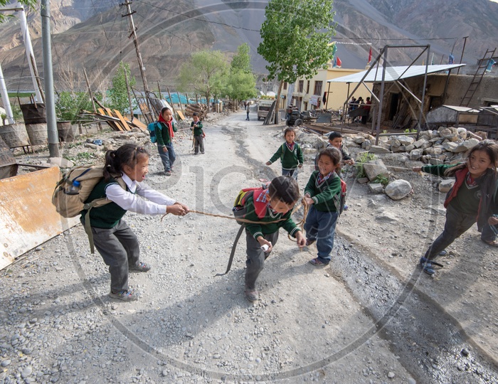 School children playing on the road in Spiti Valley