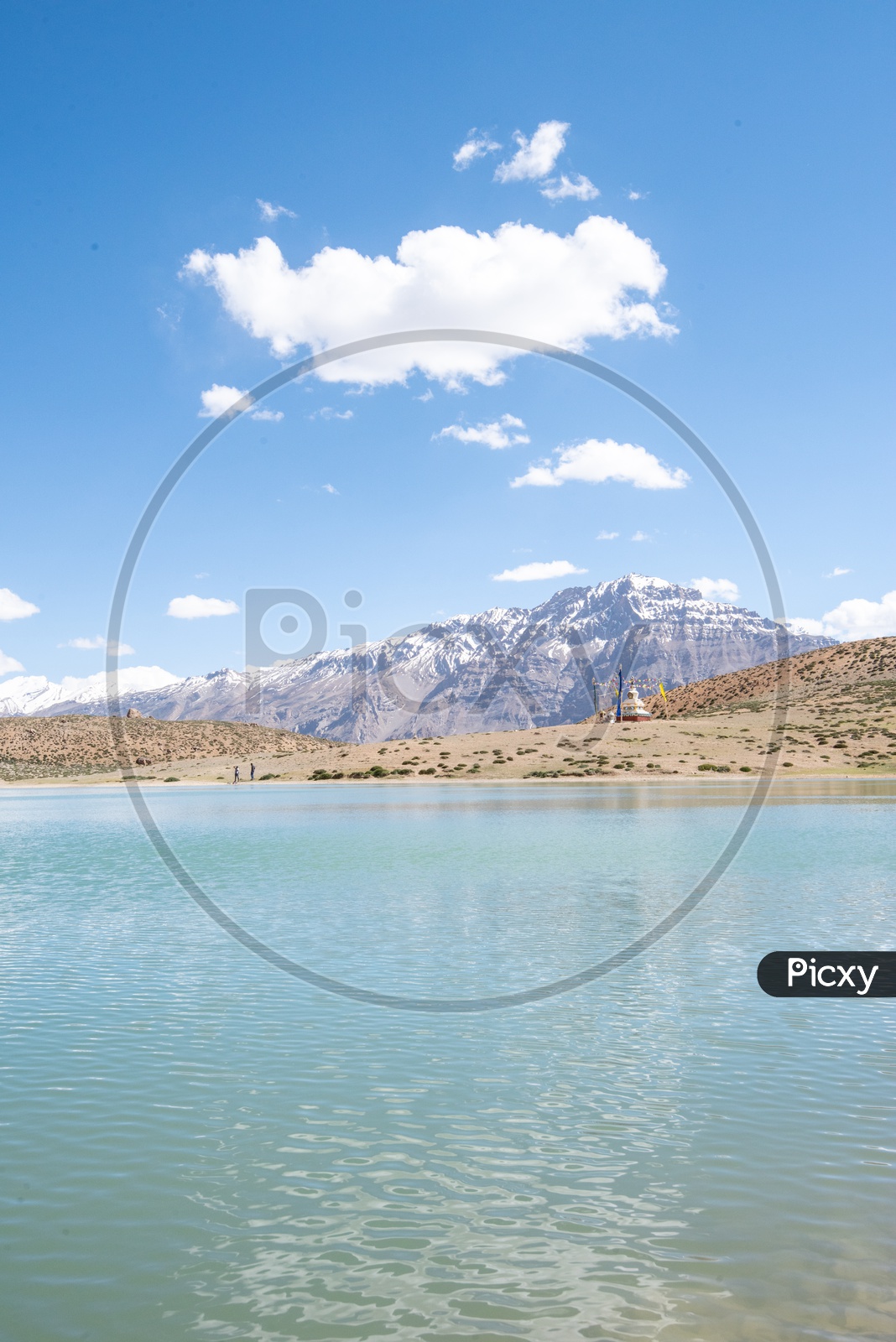Dhankar lake with snow clad mountains in the background