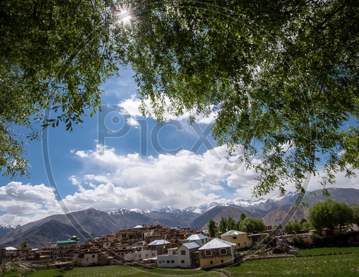 Snow Capped Mountains of Spiti Valley with houses