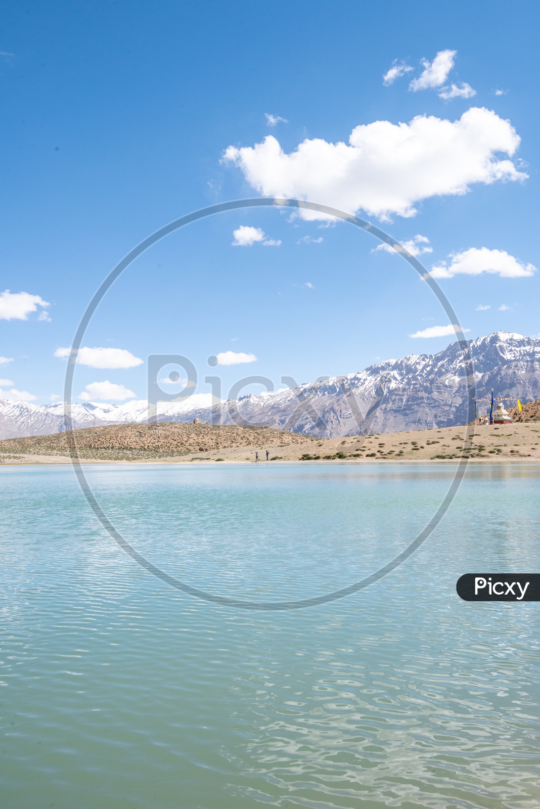 Dhankar lake with snow clad mountains in the background