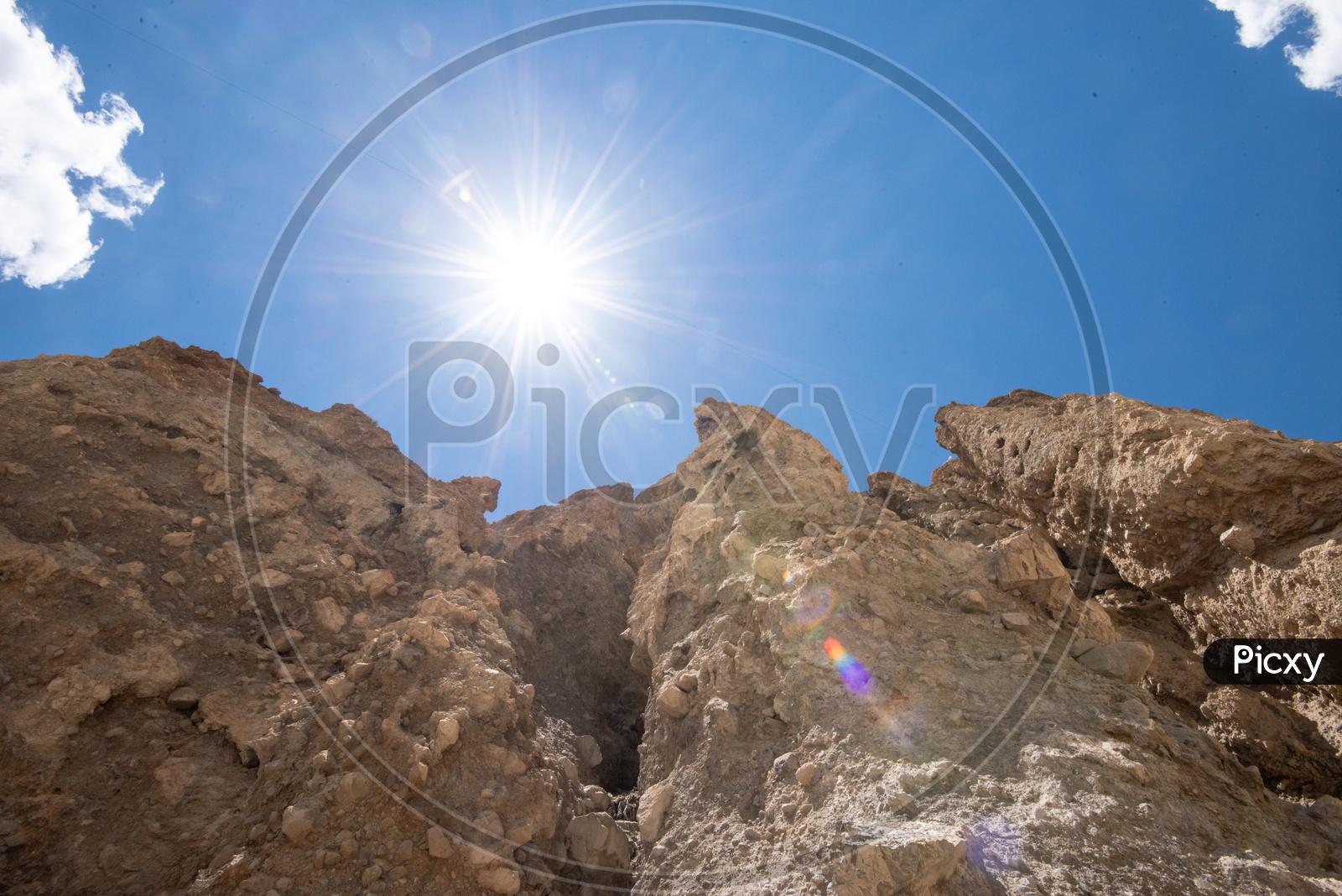 Terrain Badlands with a View of Blue Sky and Cotton Clouds