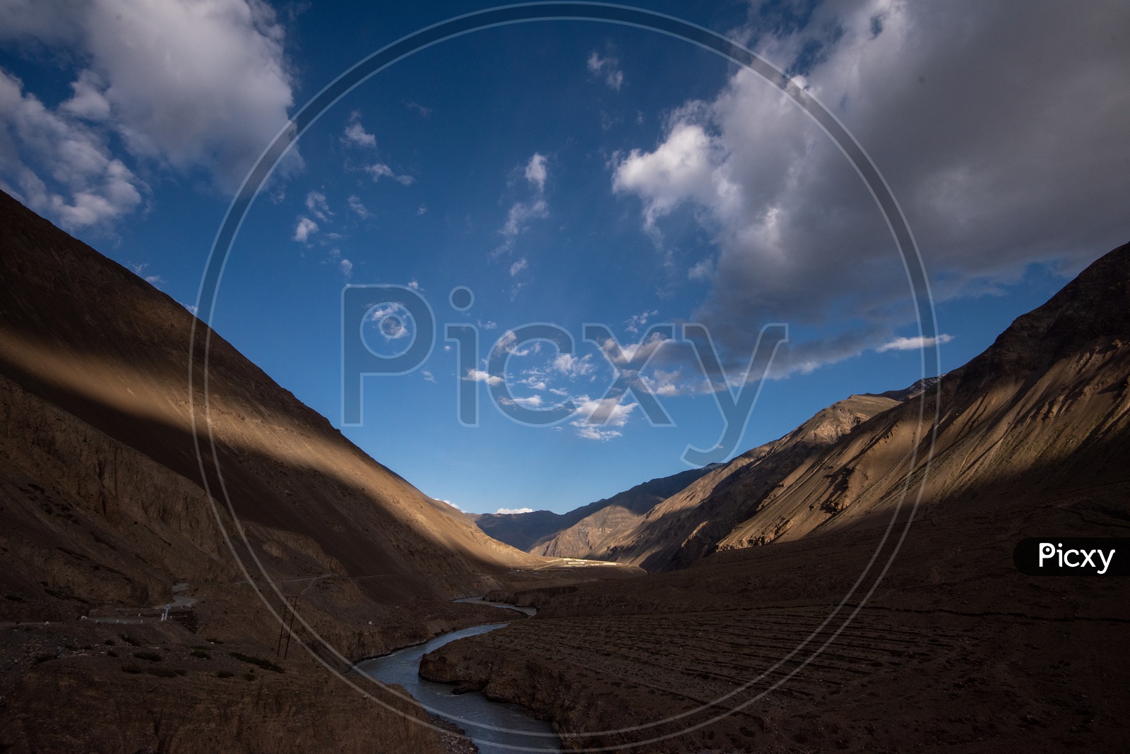 River Valleys In Leh with Sand Dunes And Blue Sky With Cotton Clouds