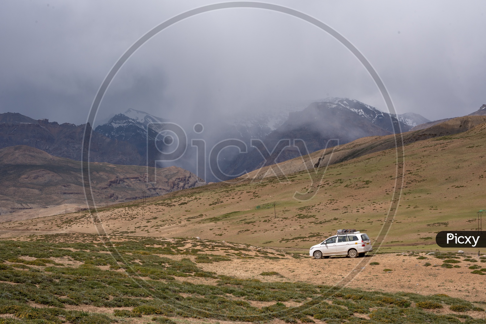 Mountains of Spiti Valley with a car in foreground