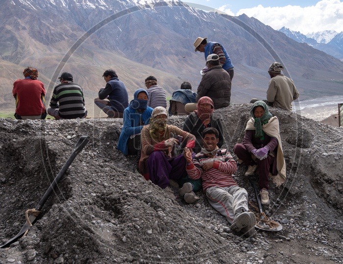 People of Spiti Valley with Snow capped Mountains in background