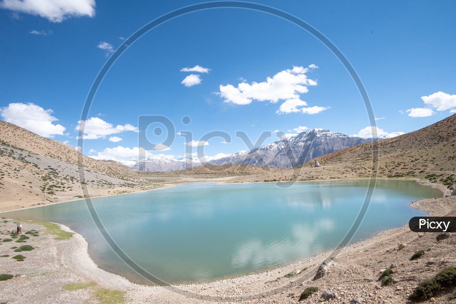 Dhankar lake with mountain peaks in the background