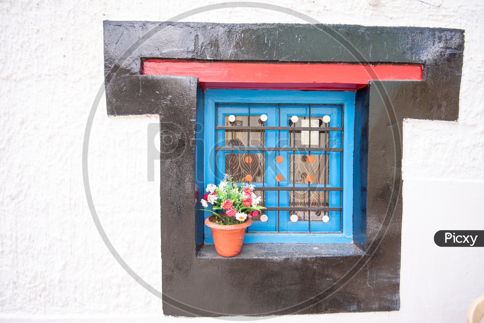 A Flower Plant Pot at Window