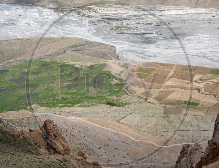 Roads and agricultural farm lands beside the river in Spiti Valley