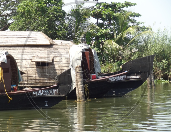Houseboats in Kerala backwaters on a sunny day