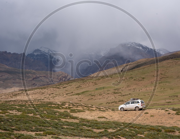 Mountains of Spiti Valley with a car in foreground