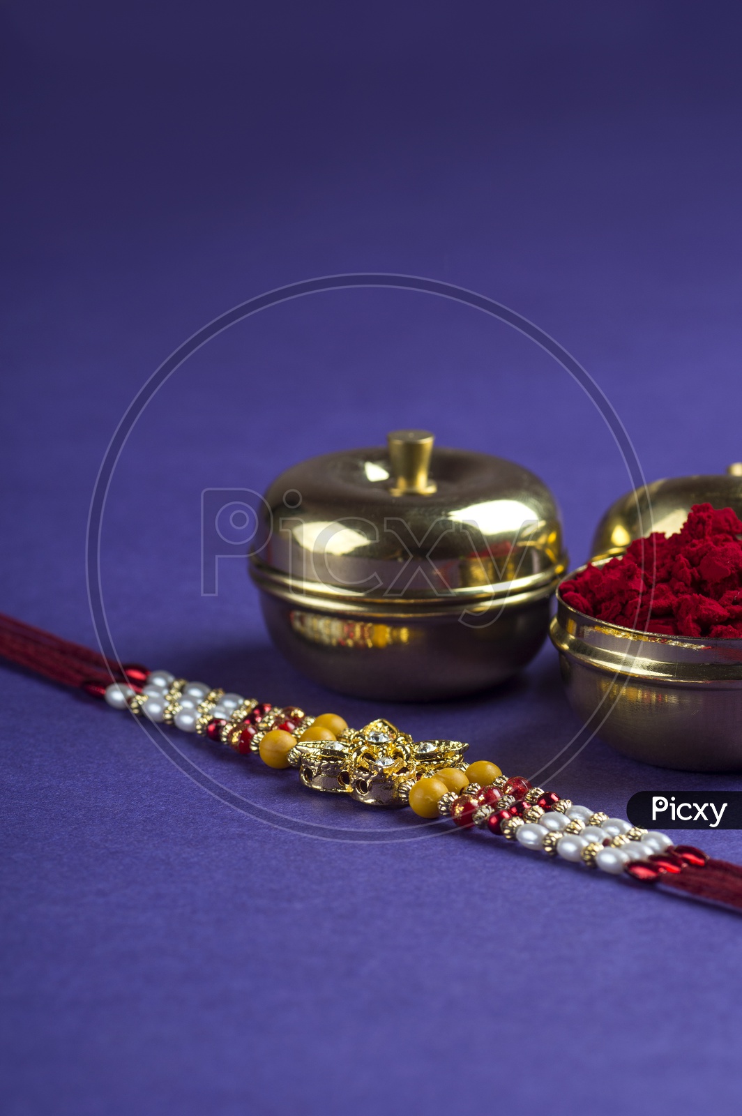 Elegant Raakhi With Rice Gains And Kumkum For Raksha Bandhan