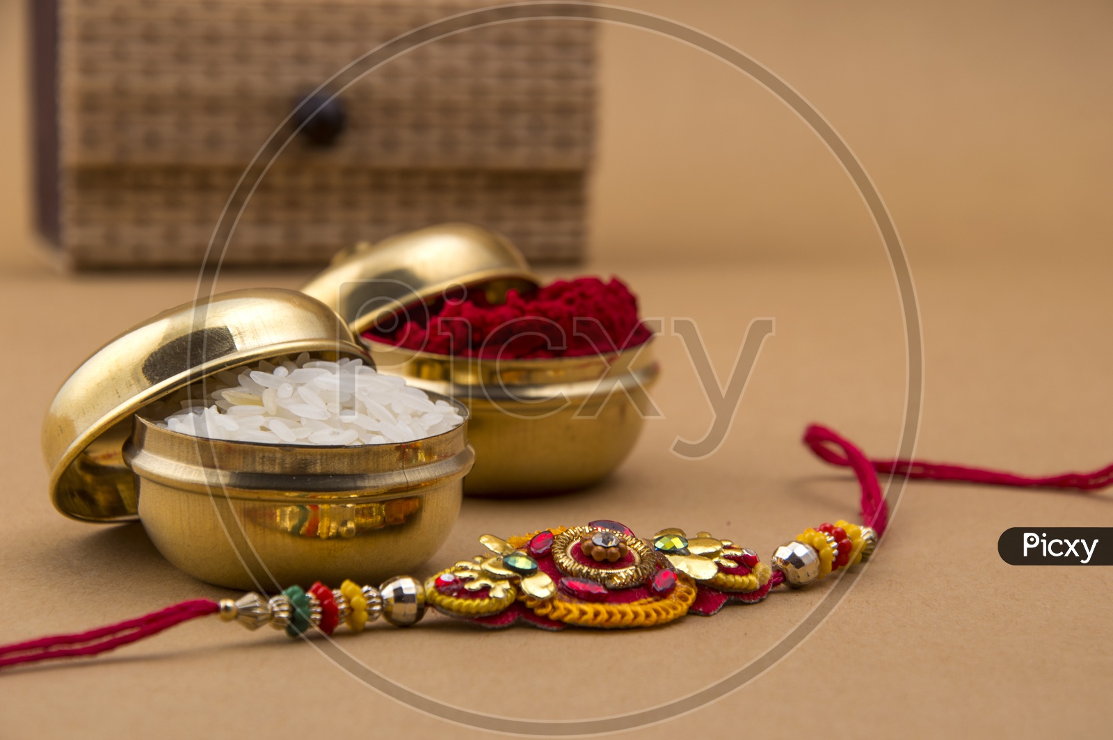Elegant Rakhi With Rice Grains ,   Kumkum  and Gift Box For Sister
