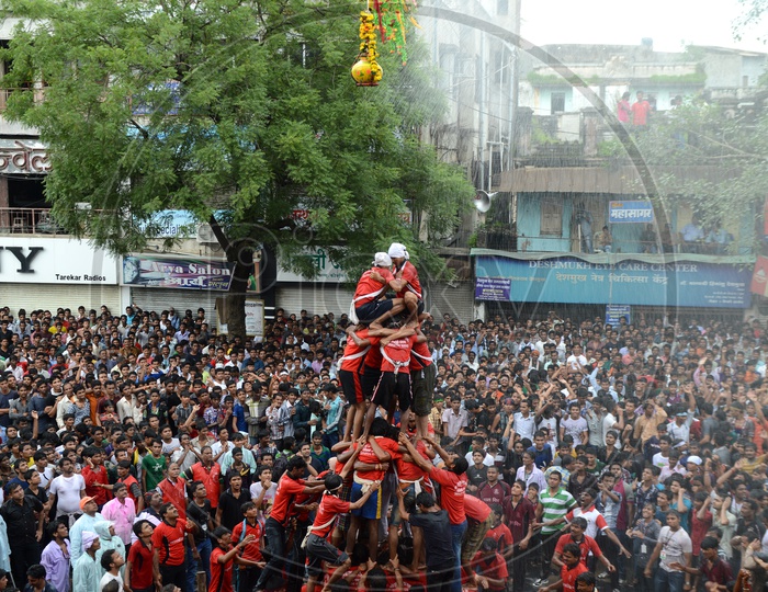 Cowd Of Young People Celebrating  'Govinda' at Dahi Handi Festival to celebrate God Krishna's  Birth in Amaravathi , Maharashtra