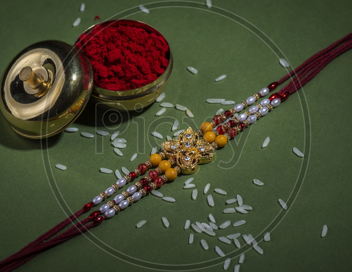 Elegant  Raakhi With Rice Grains And  Kumkum For Raksha Bandhan Festival  Wishes