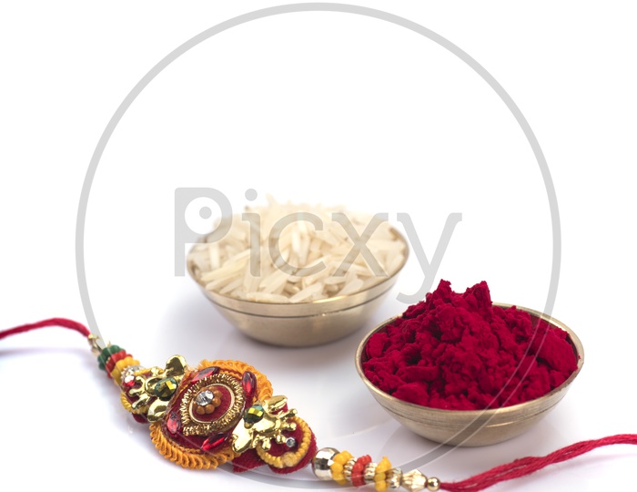 Elegant Raakhi With Rice Grains and  Kumkum  For Raksha Bandhan Festival