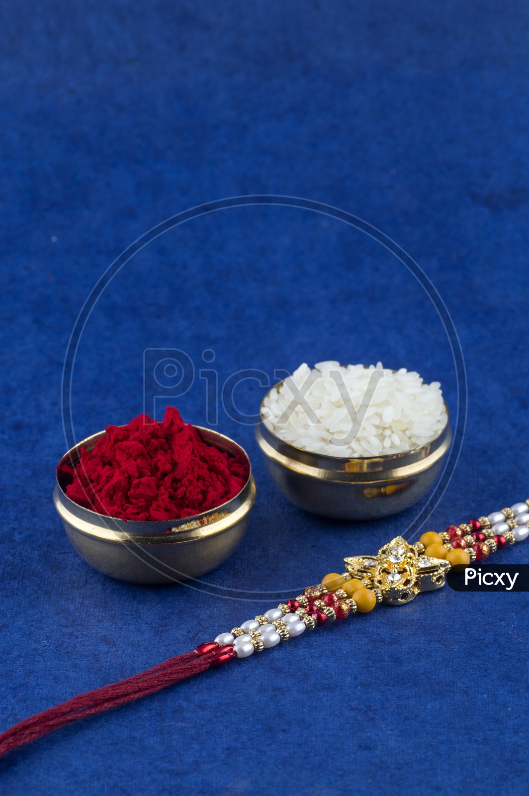 elegant Raakhi With Rice Grains And Kumkum For Raksha Bandhan Festival