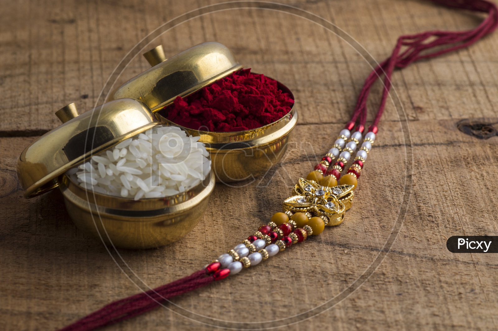 Elegant Raakhi With Kumkum and Rice Grains  For Raksha Bandhan Festival