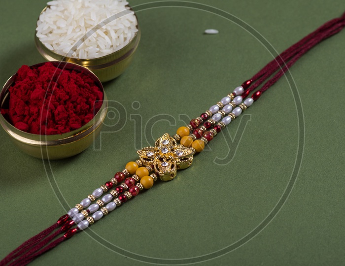 Template of Elegant  Raakhi With Rice Grains And  Kumkum For Raksha Bandhan Festival  Wishes