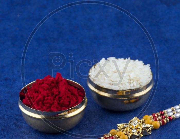 elegant Raakhi With Rice Grains And Kumkum For Raksha Bandhan Festival