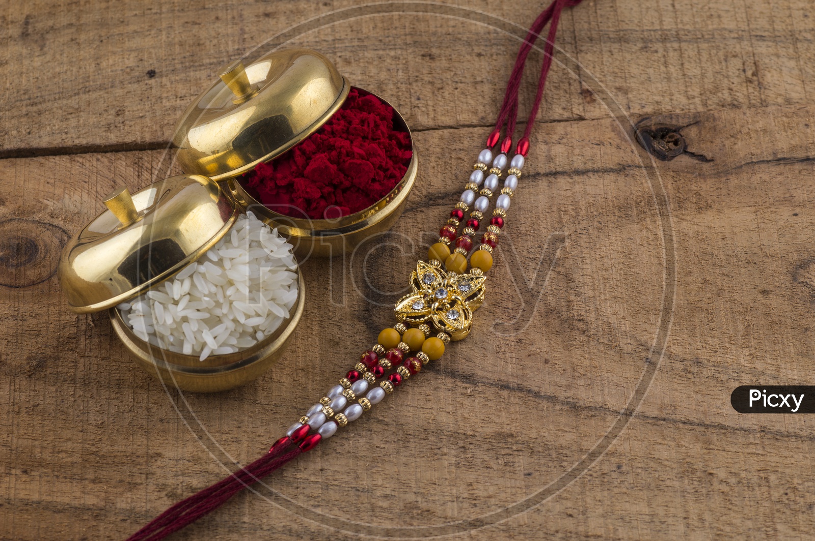 Elegant Raakhi With Rice Grains and Kumkum For Raksha Bandhan Festival