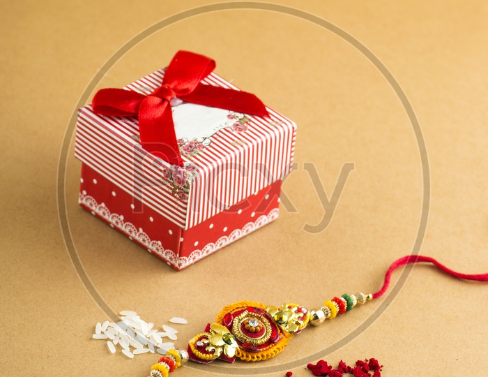 Elegant Raakhi With Rice Grains , Kumkum  And Gift Box  For Raksha Bandan Festival