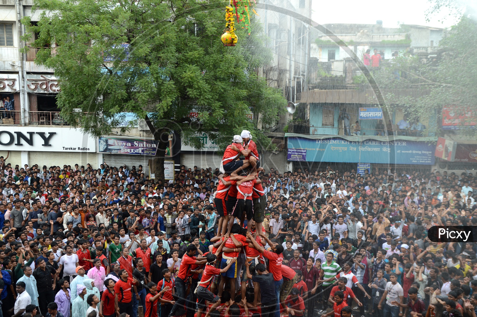 Cowd Of Young People Celebrating  'Govinda' at Dahi Handi Festival to celebrate God Krishna's  Birth in Amaravathi , Maharashtra