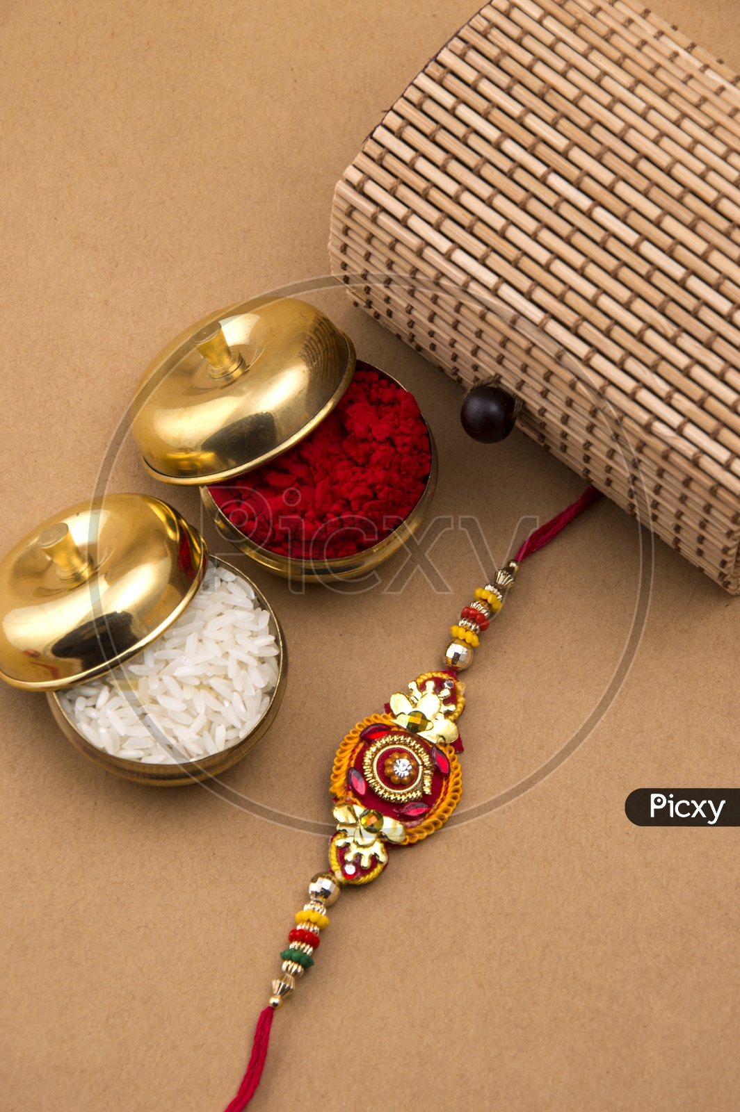 Elegant Rakhi With Rice Grains And Kumkum And Gift Box For Sister