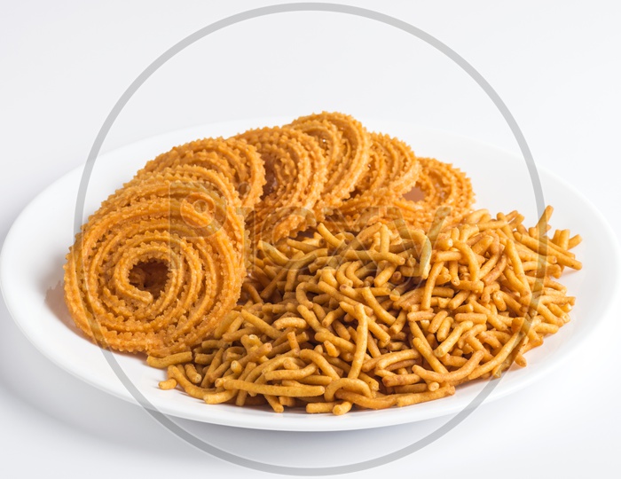 Chakli, chakali or Murukku and Besan Sev in a plate