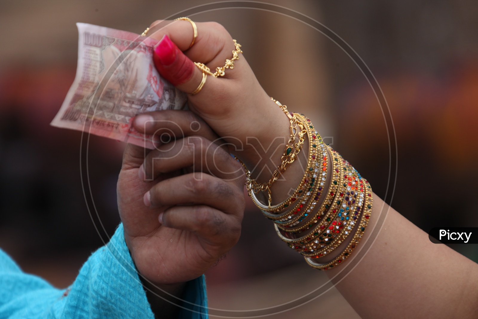 A Man Taking a Currency Note From a Lady Hand Closeup