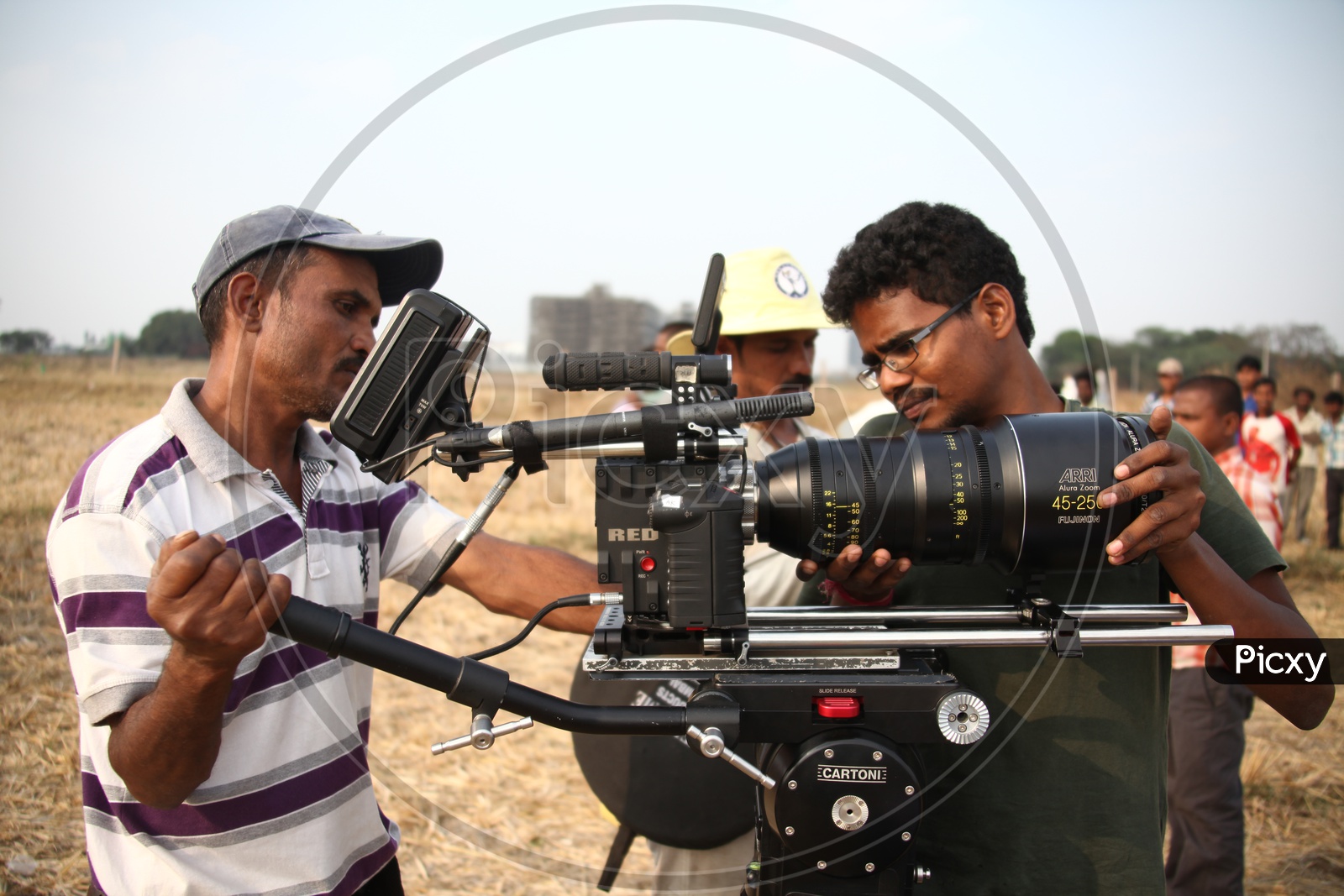 Technician Fitting Lenses For  Movie Shooting Camera