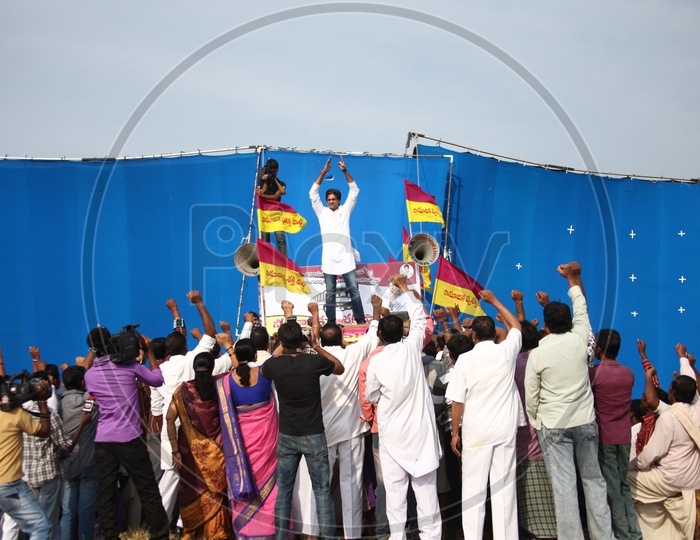 Crowd Hailing The  Young Leader or Politician  On Dias