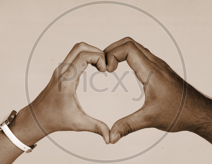 Couple hands with heart symbol