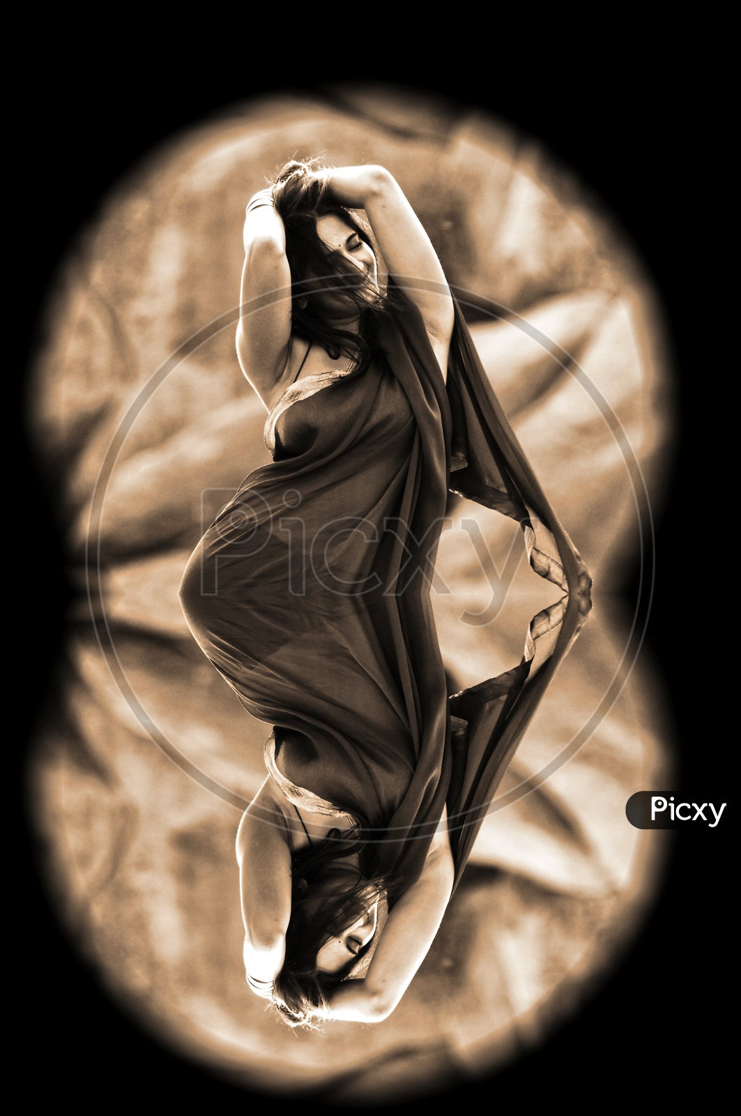 Optical illusion of dance pose of a woman in saree