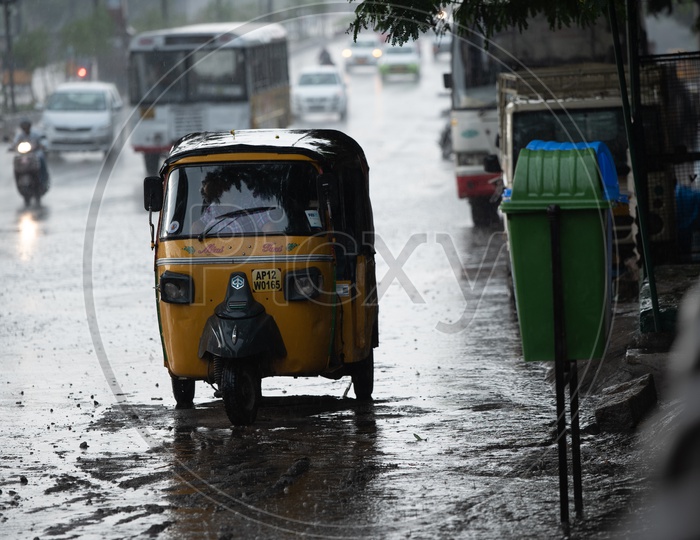 Autos On the Flooded City Roads In a Rainy Day