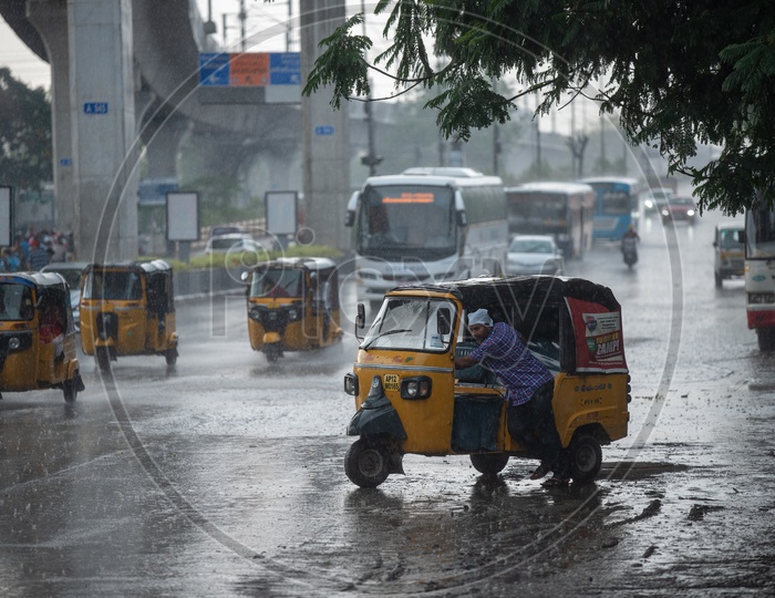 Autos On the Flooded City Roads on a Rainy Day
