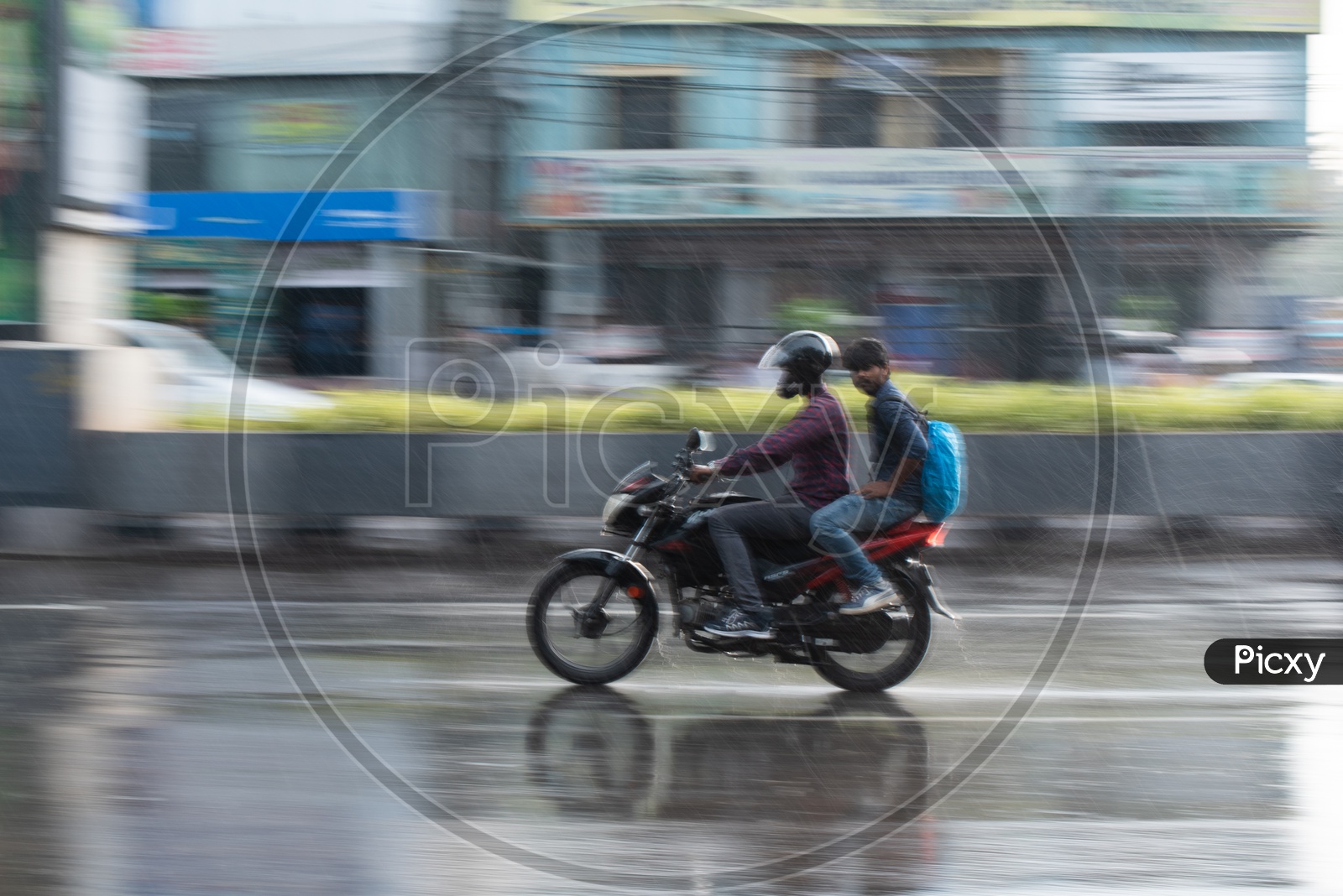 Motorcyclists Or Bike Commuters On Flooded City Roads On A Rainy Day