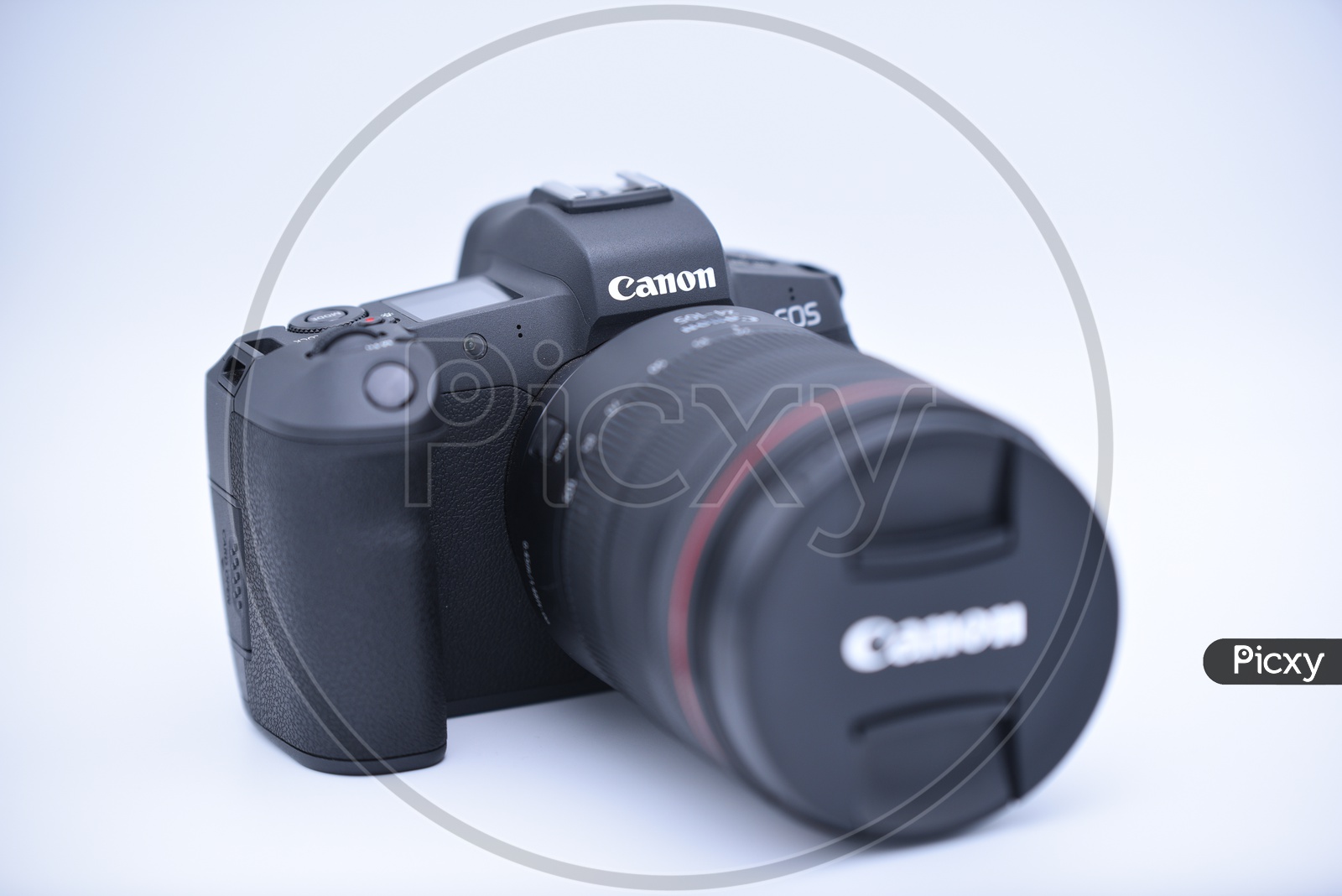 Cannon EOS R  Camera Mounted To 24 - 105 mm Lens On an Isolated White Background