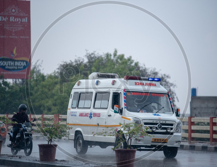 Ambulance On road in a Rainy Day