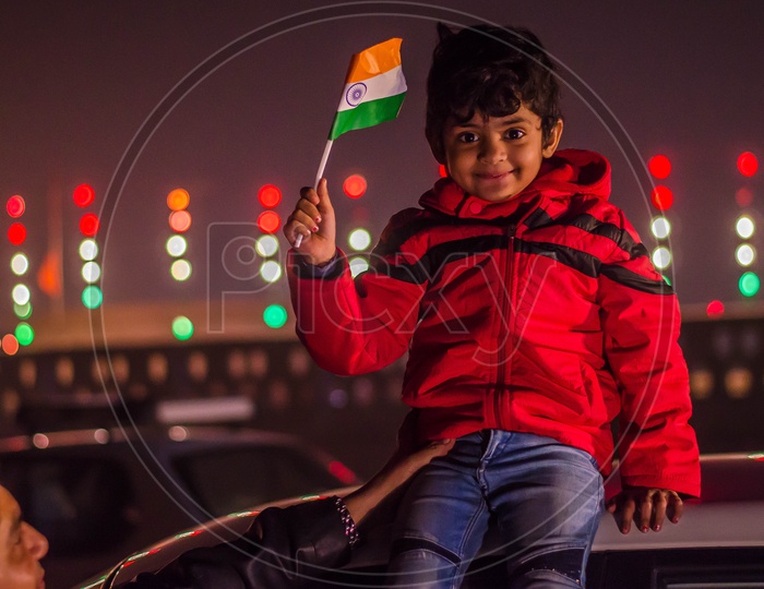 A Young Indian Boy Holding Indian National Flag