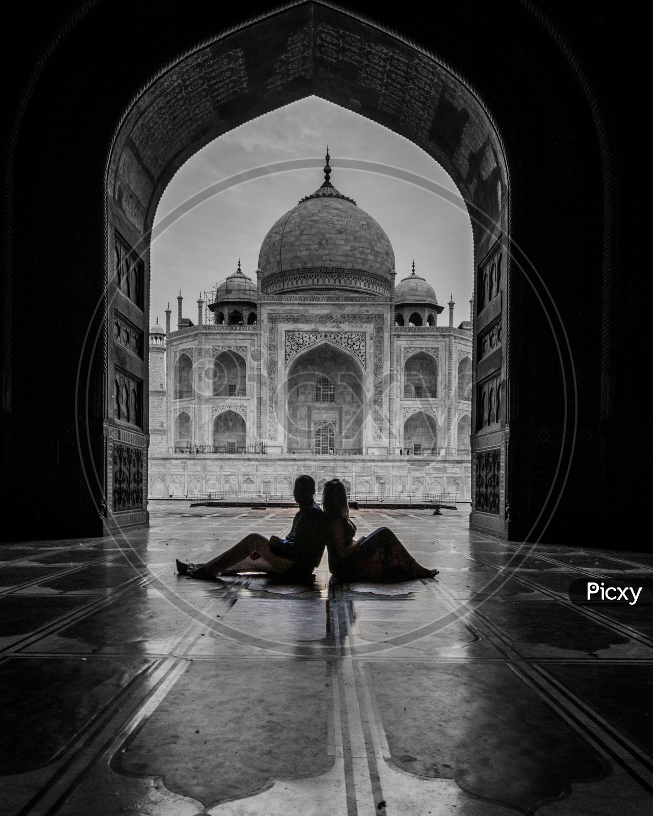 Silhouette of a Couple Posing Before Taj Mahal