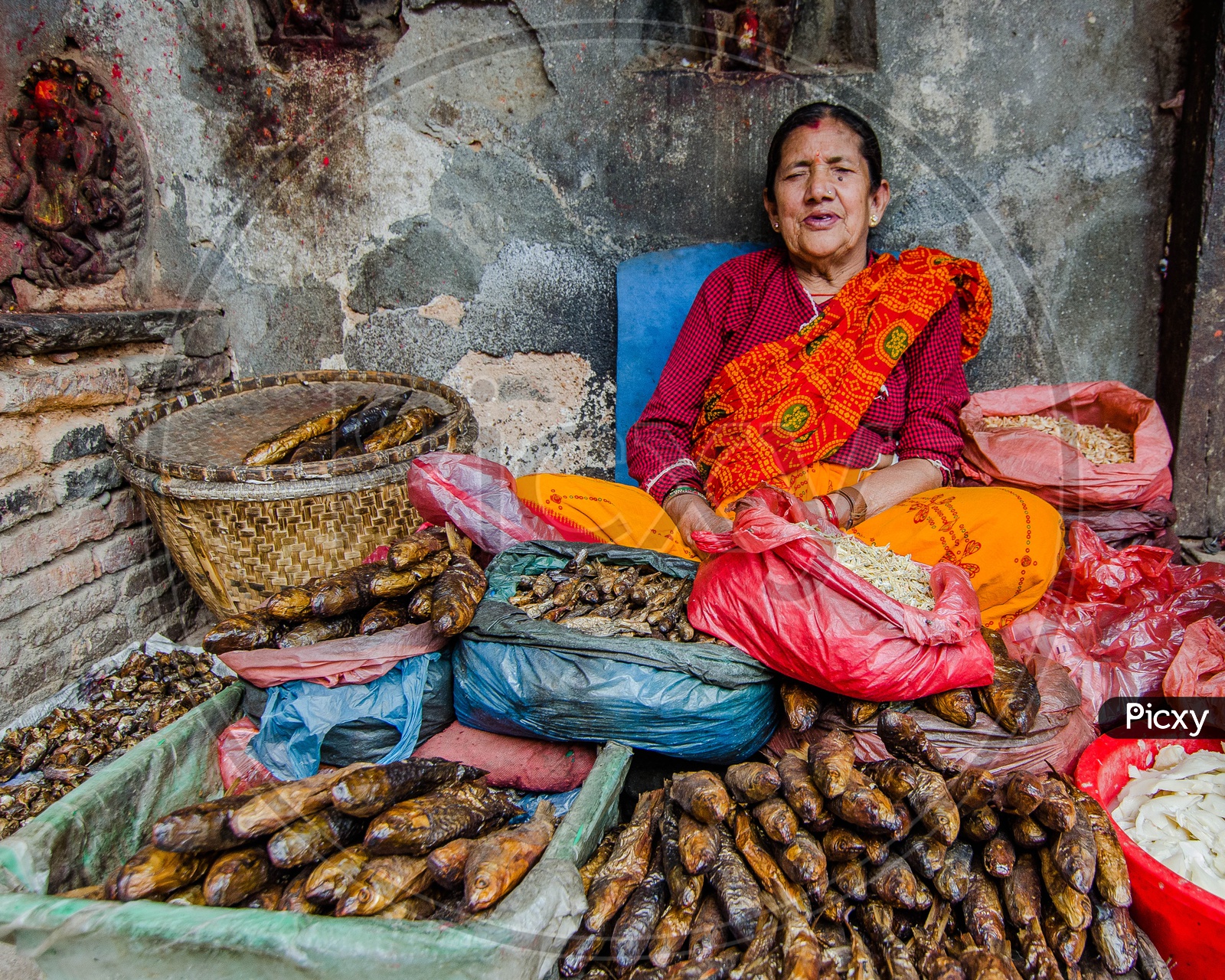 A Woman Vendor Of Dried Fish