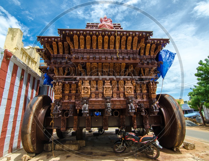Beautifully sculptured wooden Chariot beside a temple