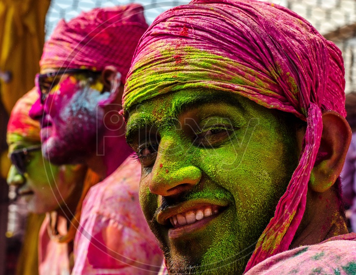 Locals People Filled In Colors At Lathmar Holi Celebrations