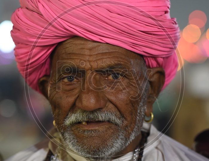 Portrait of an Indian old man with pink turban