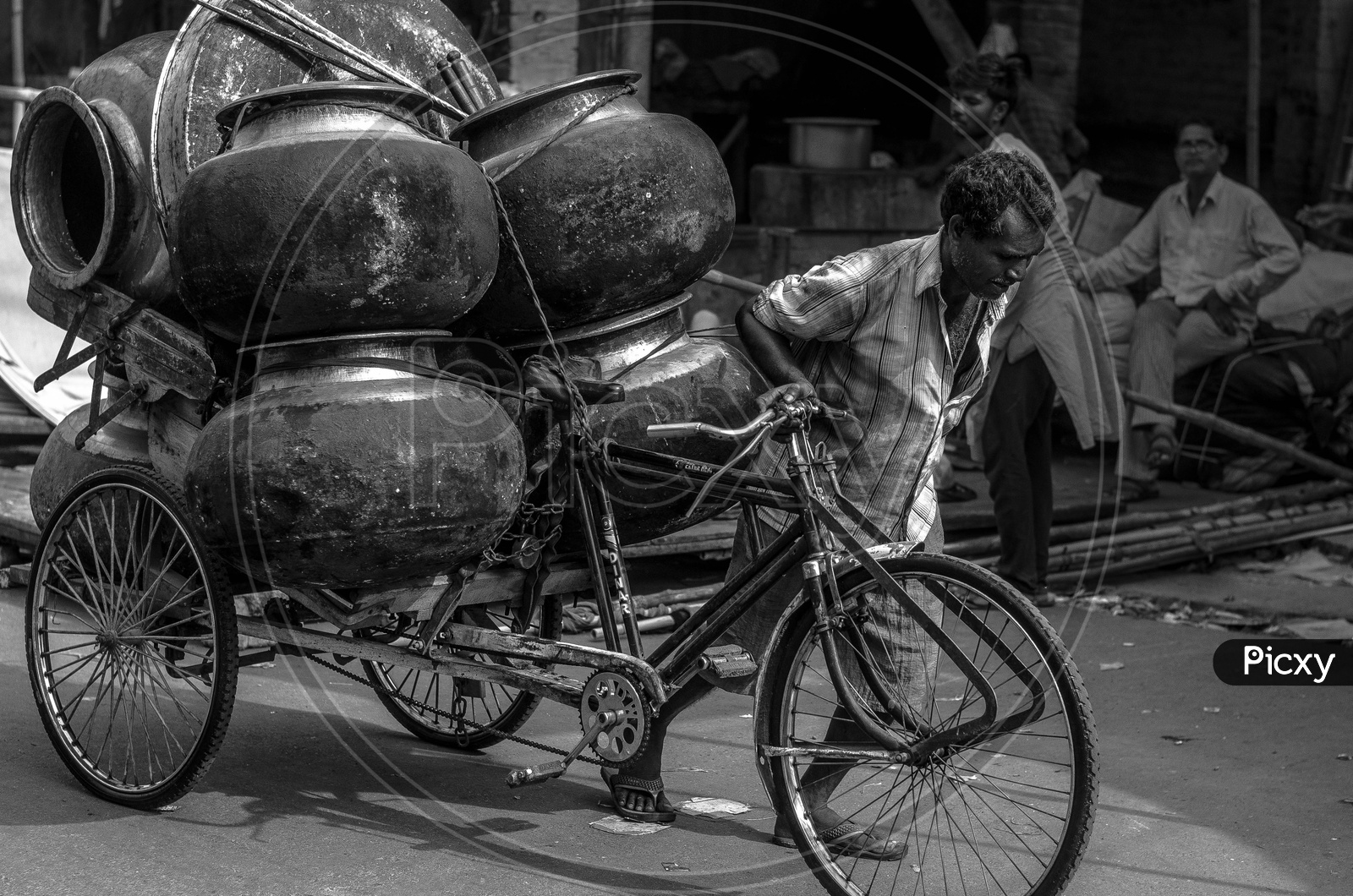 A Rickshaw Puller Pulling The Heavy Goods On the Streets Of India