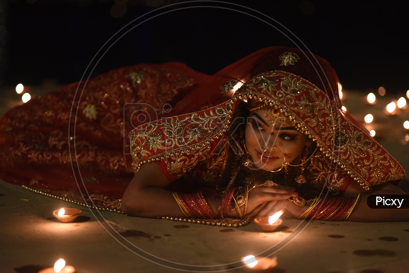 A Traditional Indian Woman  In Elegant Look With Diwali Dias  and Posing