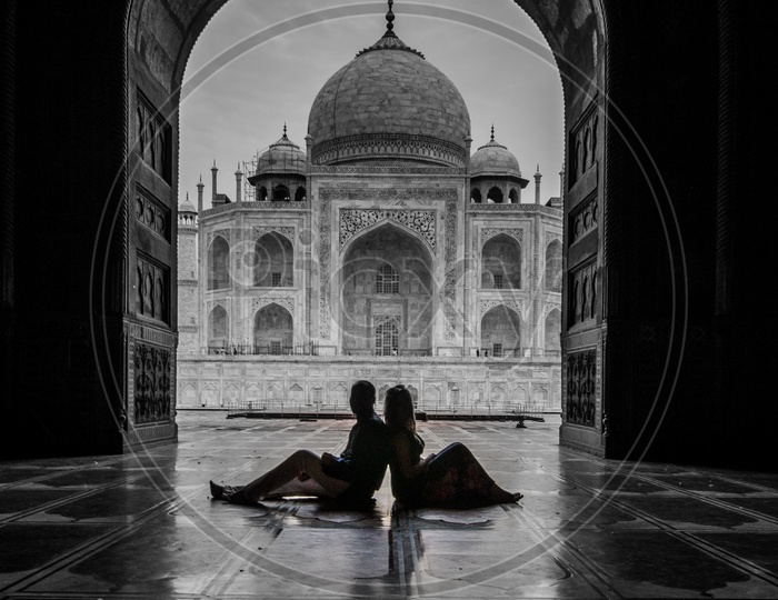 Silhouette of a Couple Posing Before Taj Mahal