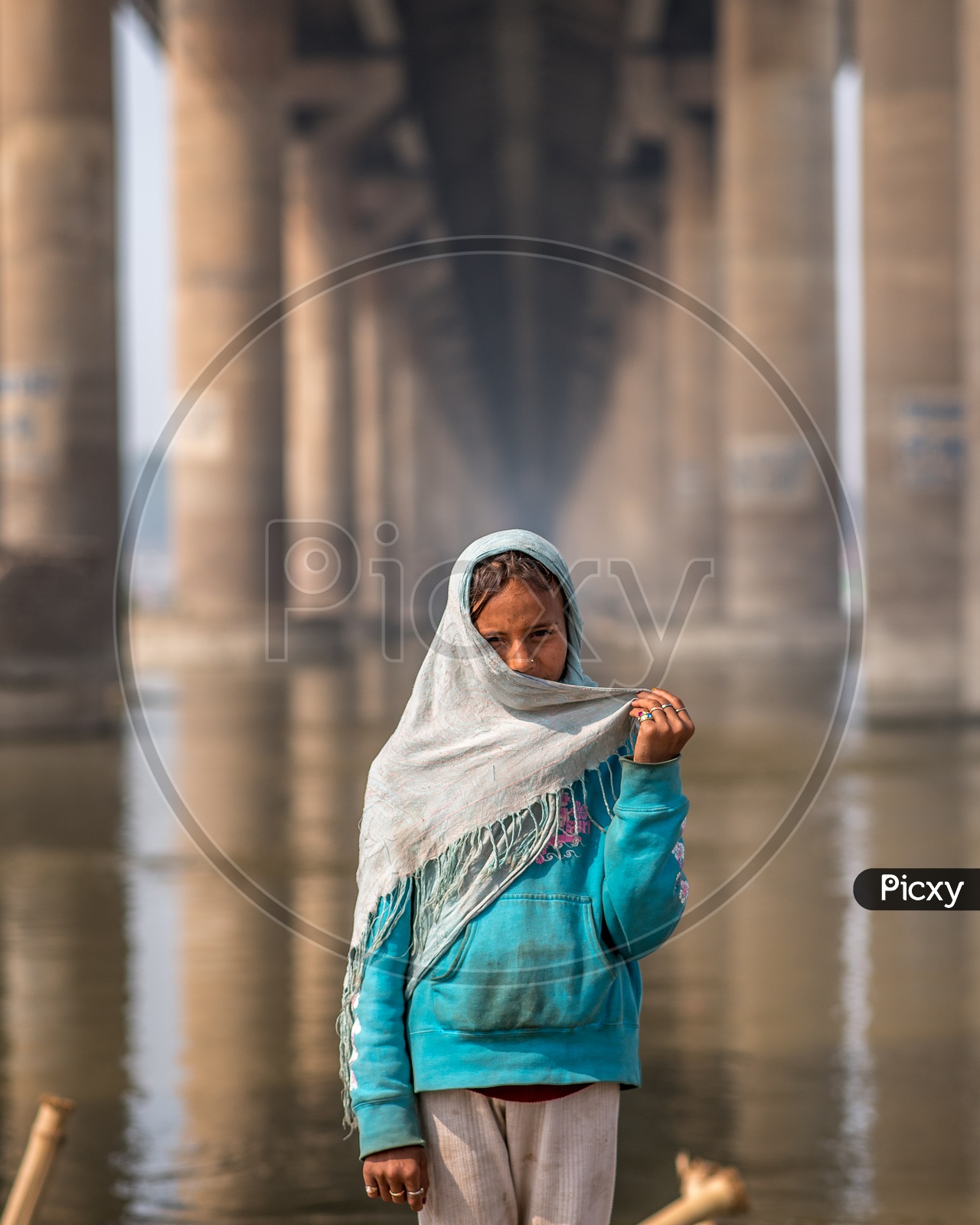 A Young Indian Girl Portrait At a Water Bridge