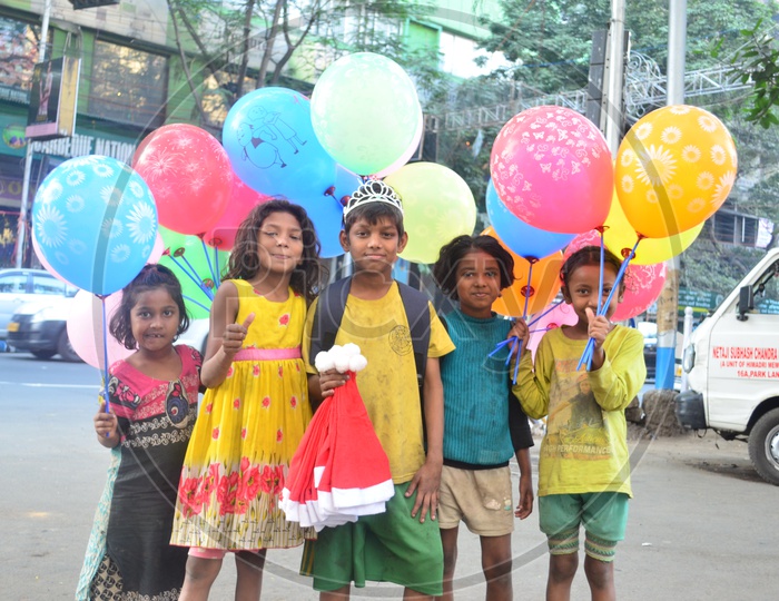 Children Vendors Of Color Balloons In Streets of India